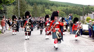 Massed pipes amp drums parade through town to the 2019 Ballater Highland Games in Scotland [upl. by Geehan]