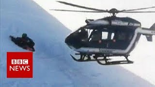 Skiers rescued in dramatic helicopter manoeuvre  BBC News [upl. by Hamaso717]