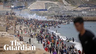 Migrants met by Spanish military as they swim to north African enclave Ceuta [upl. by Liana]