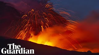 Mount Etna lights Sicilys night sky with red hot lava [upl. by Gilberto205]